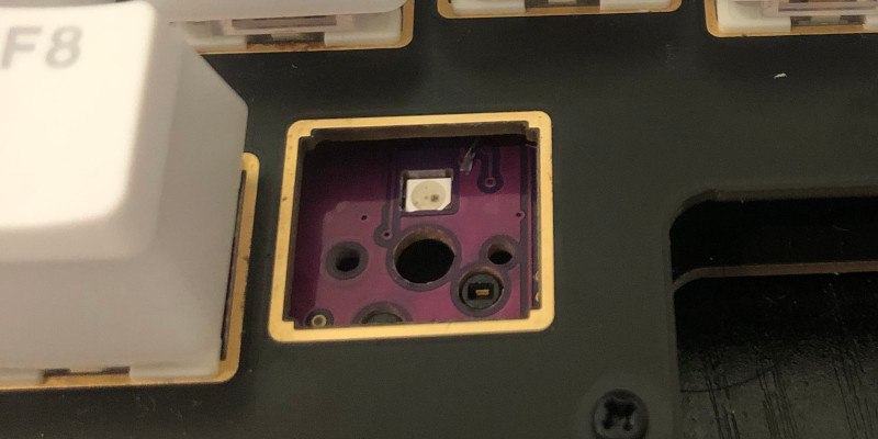 An unattractive hole and potential debris damage after the rogue keycap and switch are removed.